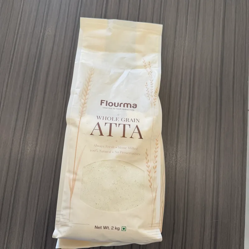 Nikhil T. holding a pack of Flourma Multigrain Protein